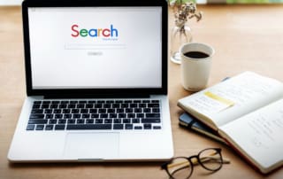 Google search, computer on desk